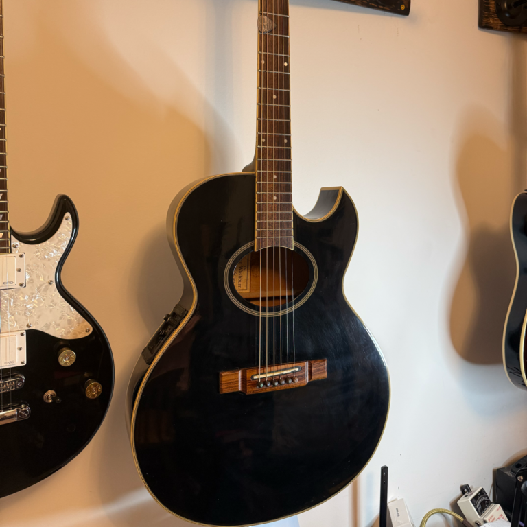 Professional guitar string change Fresh guitar strings fitted and stretched correctly during a professional string change