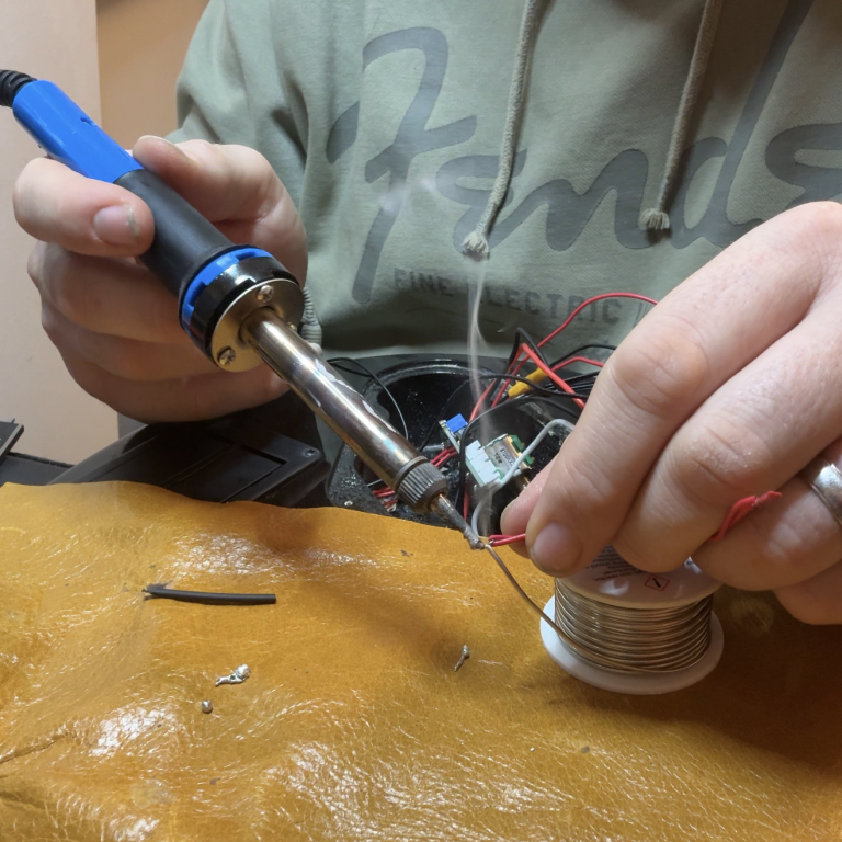 Guitar electronics repair and upgrades Guitar electronics repair in progress, including pickup wiring and control adjustments