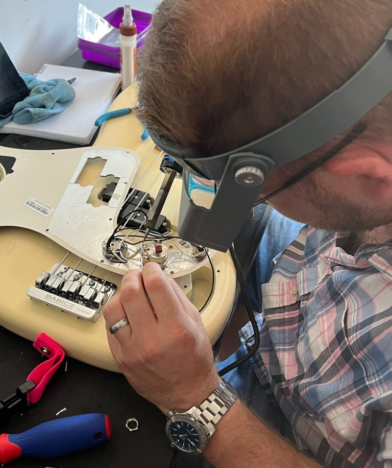 Guitar electronics repair and Upgrades Repairing guitar electronics including pots and wiring during a professional electronics service in Highbridge, Somerset
